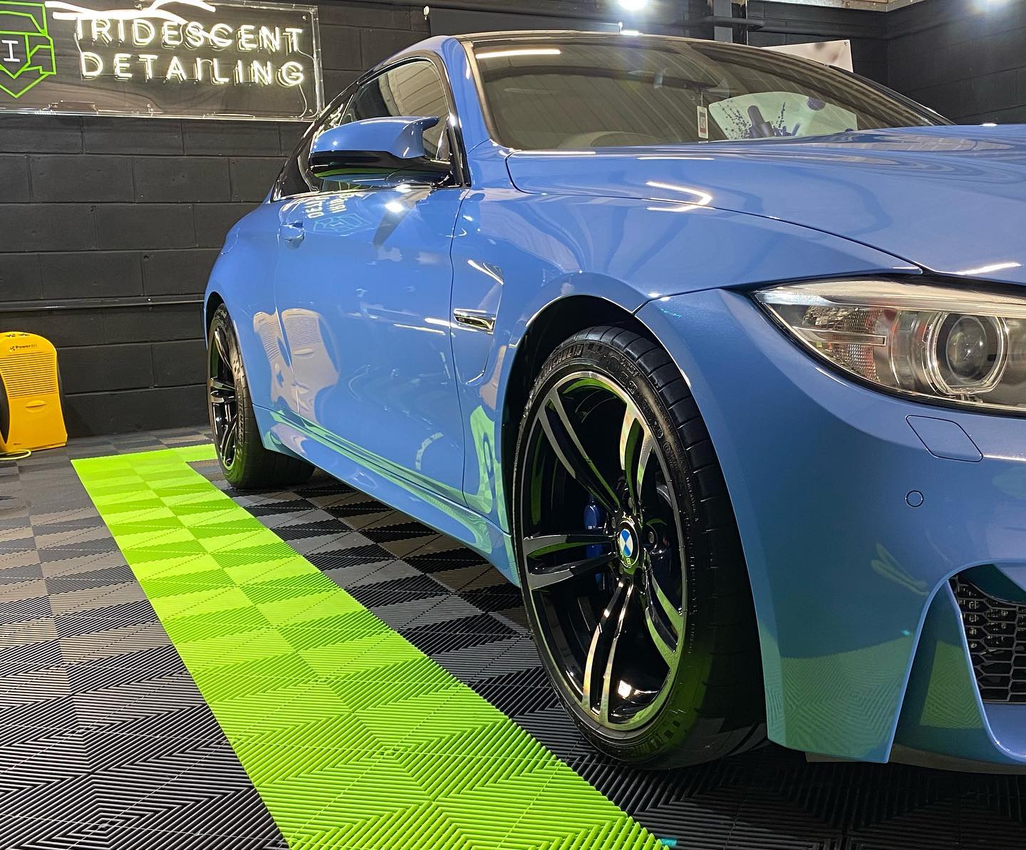 BMW in detailing studio with swisstrax