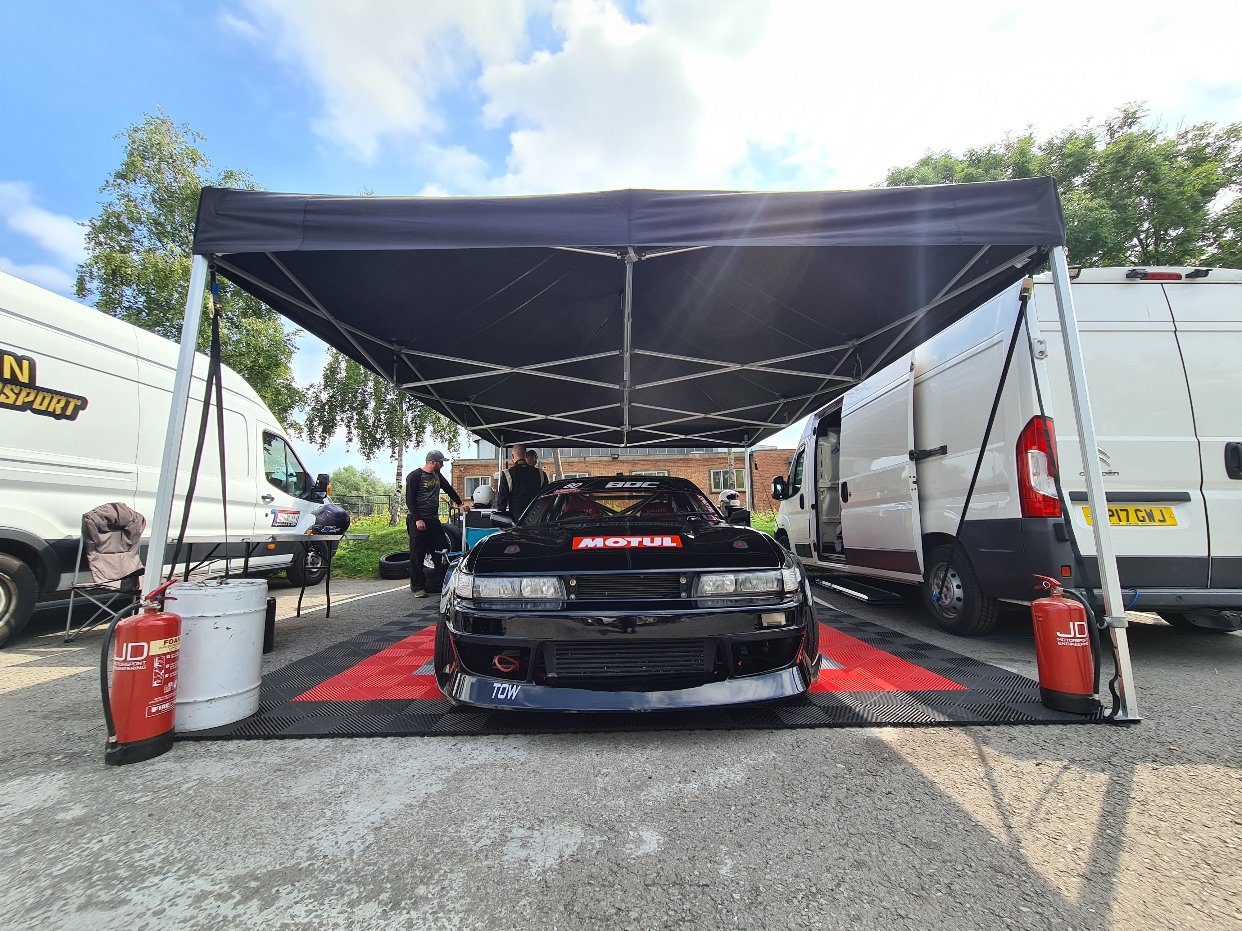 car under gazebo on swisstrax flooring