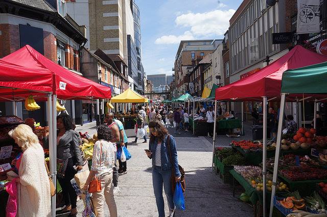 busy market full of gazebos