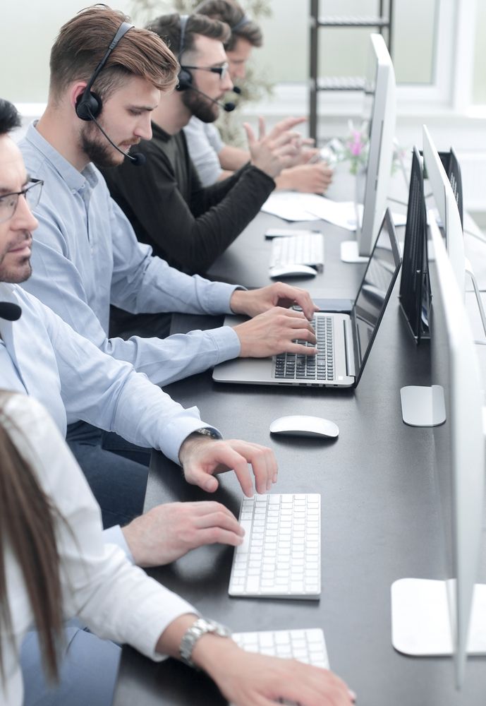 call centre staff at their desks in a row
