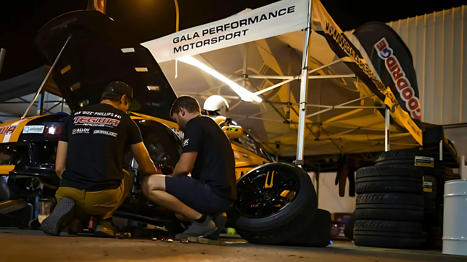 Car under branded gazebo