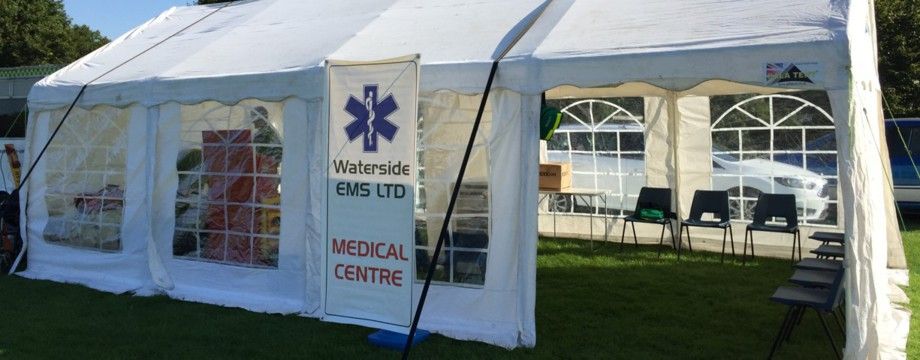St John's ambulance crew beneath a gazebo