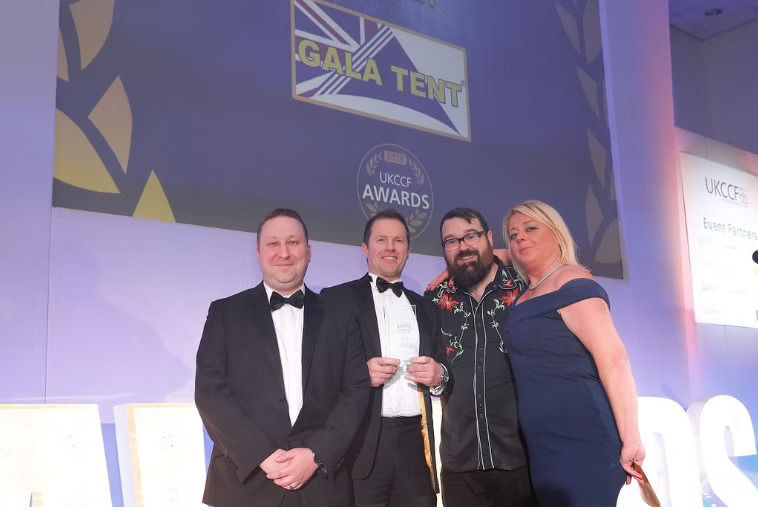 Jason Mace accepts asard at UKCCF awards