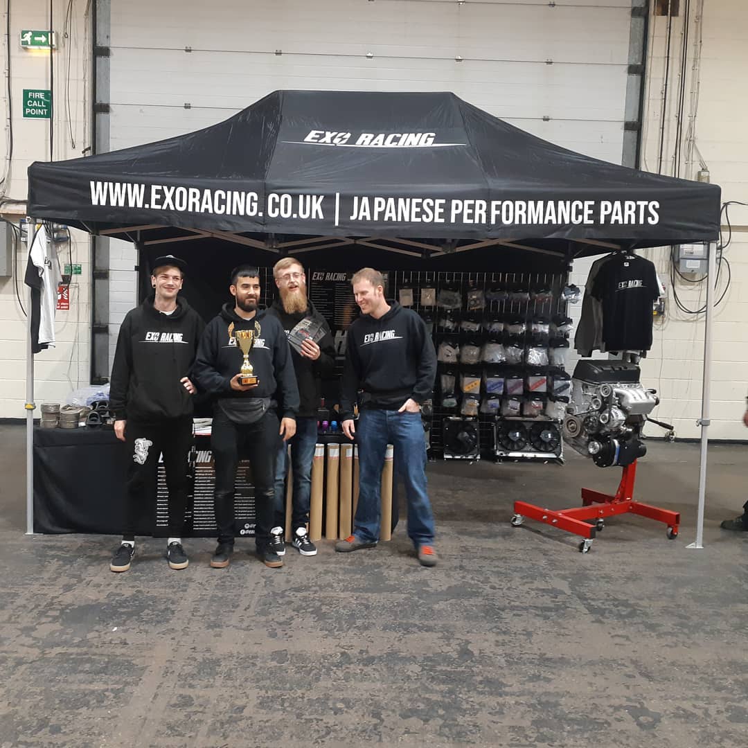 black printed exhibition tent with sales crew