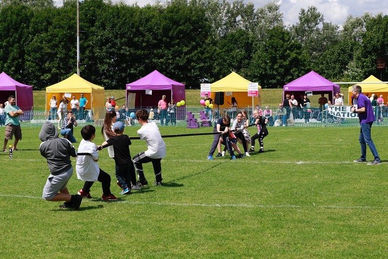 children do tug o war at school sports day