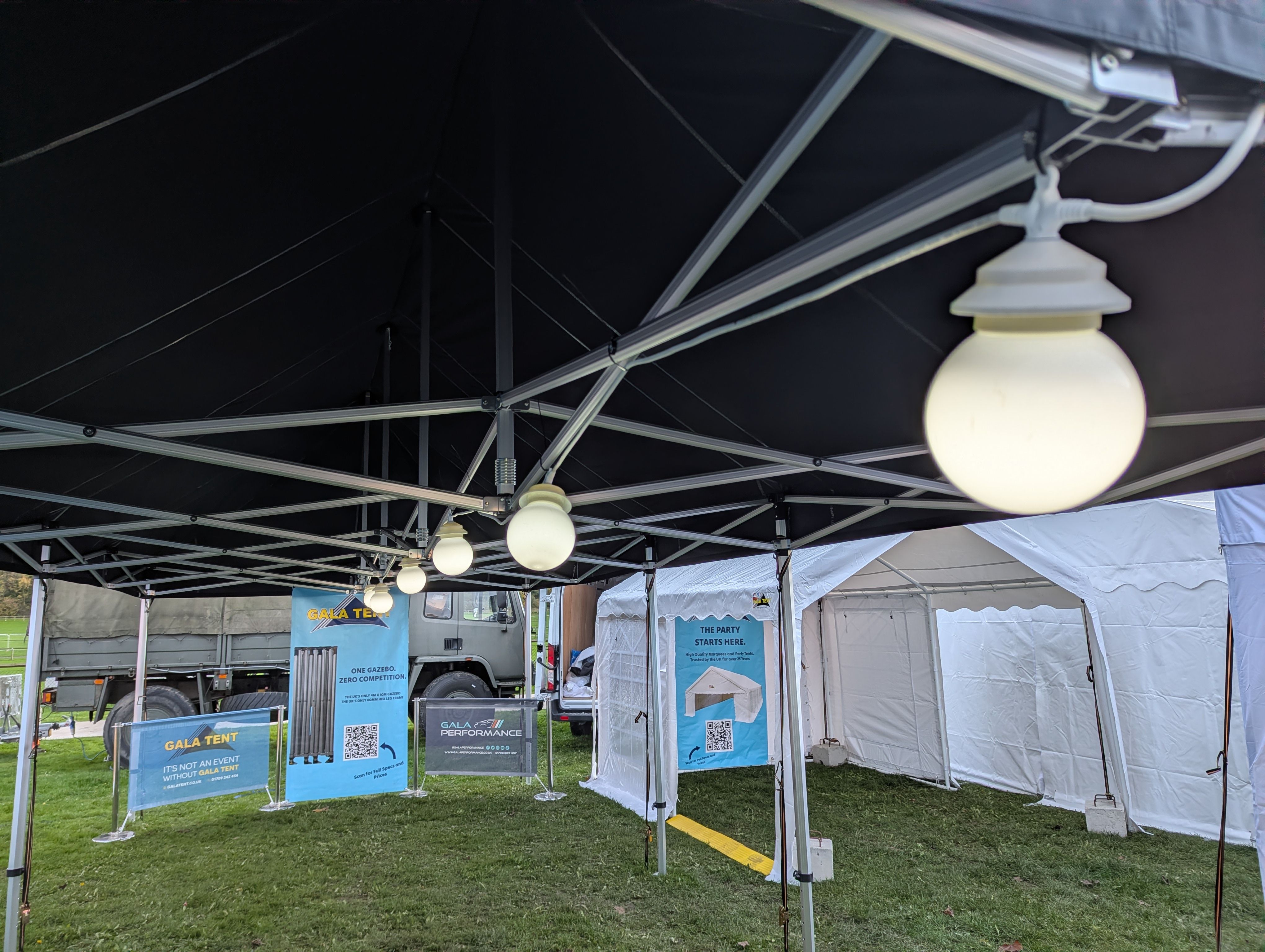 LED globe lights hanging from a gazebo frame