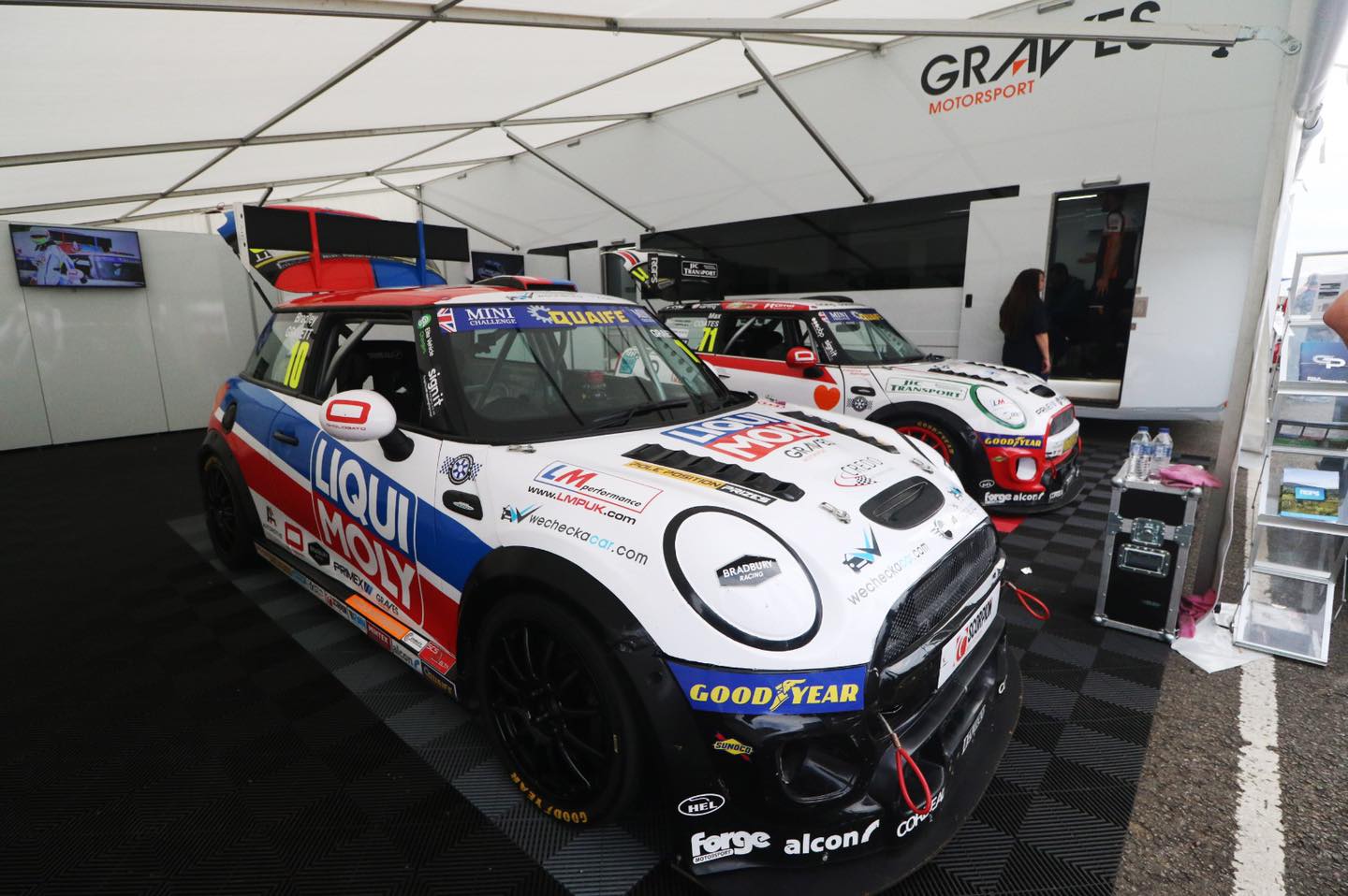 race cars on swisstrax on concrete