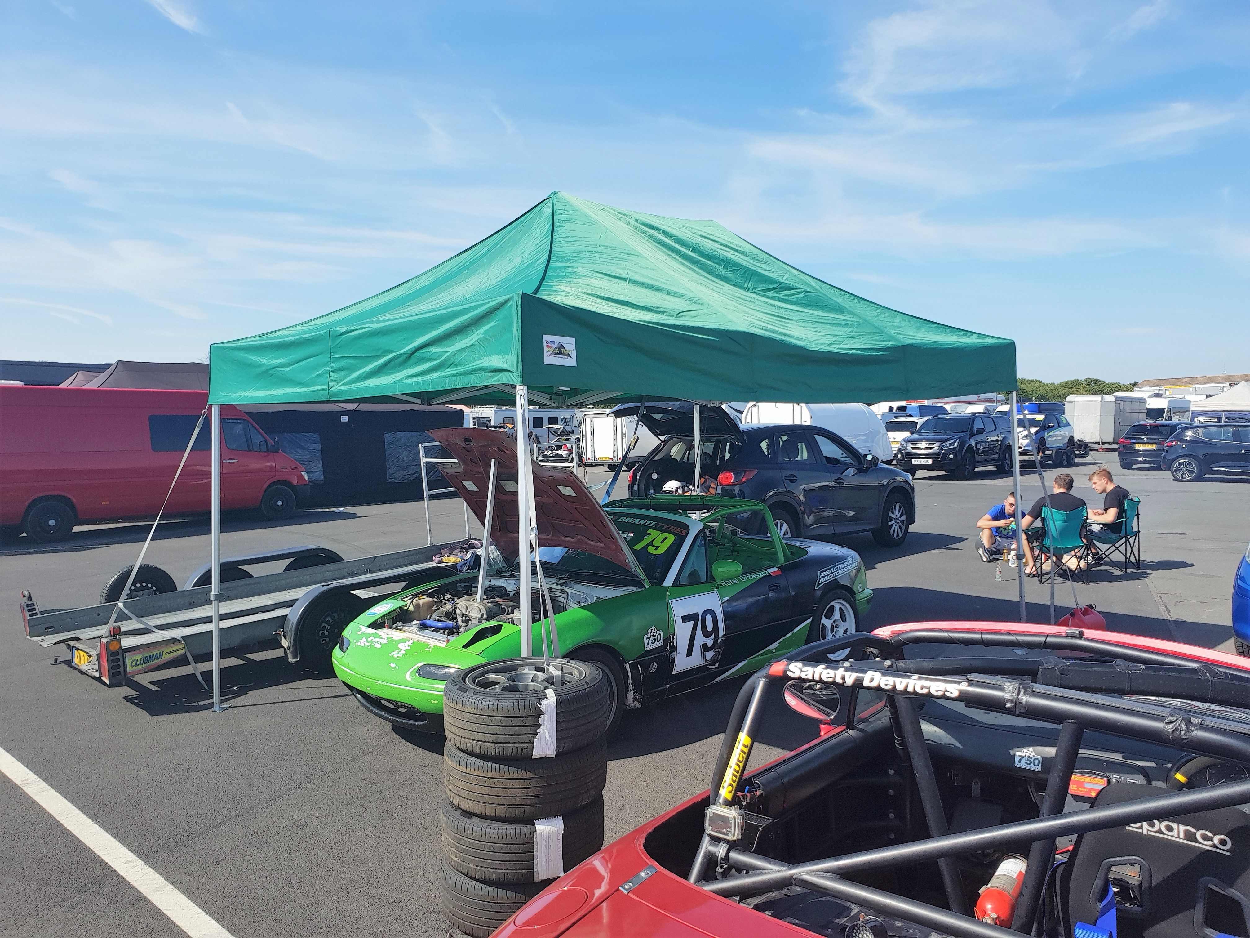 Race car under green gazebo