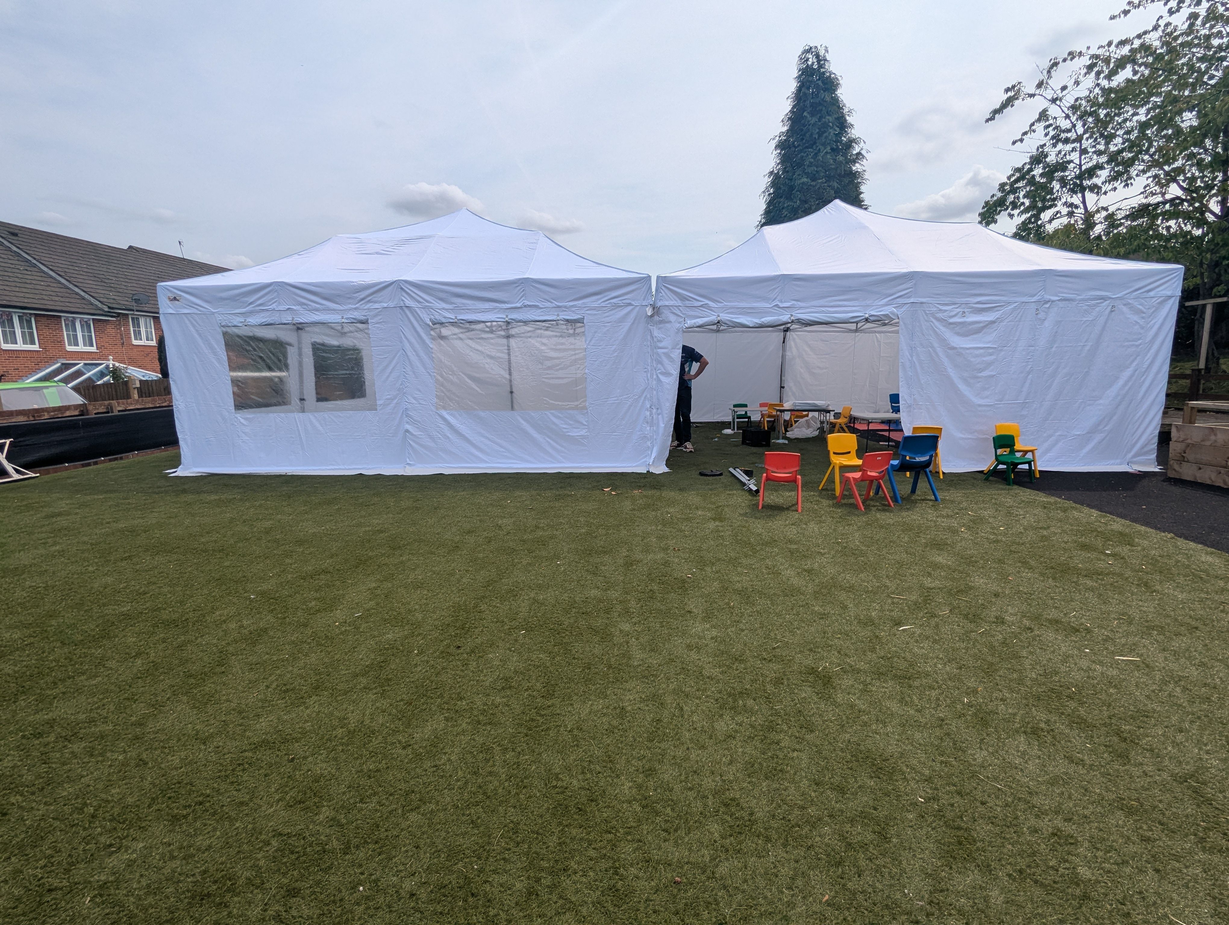 two white 6m x 6m pop up marquees connected together