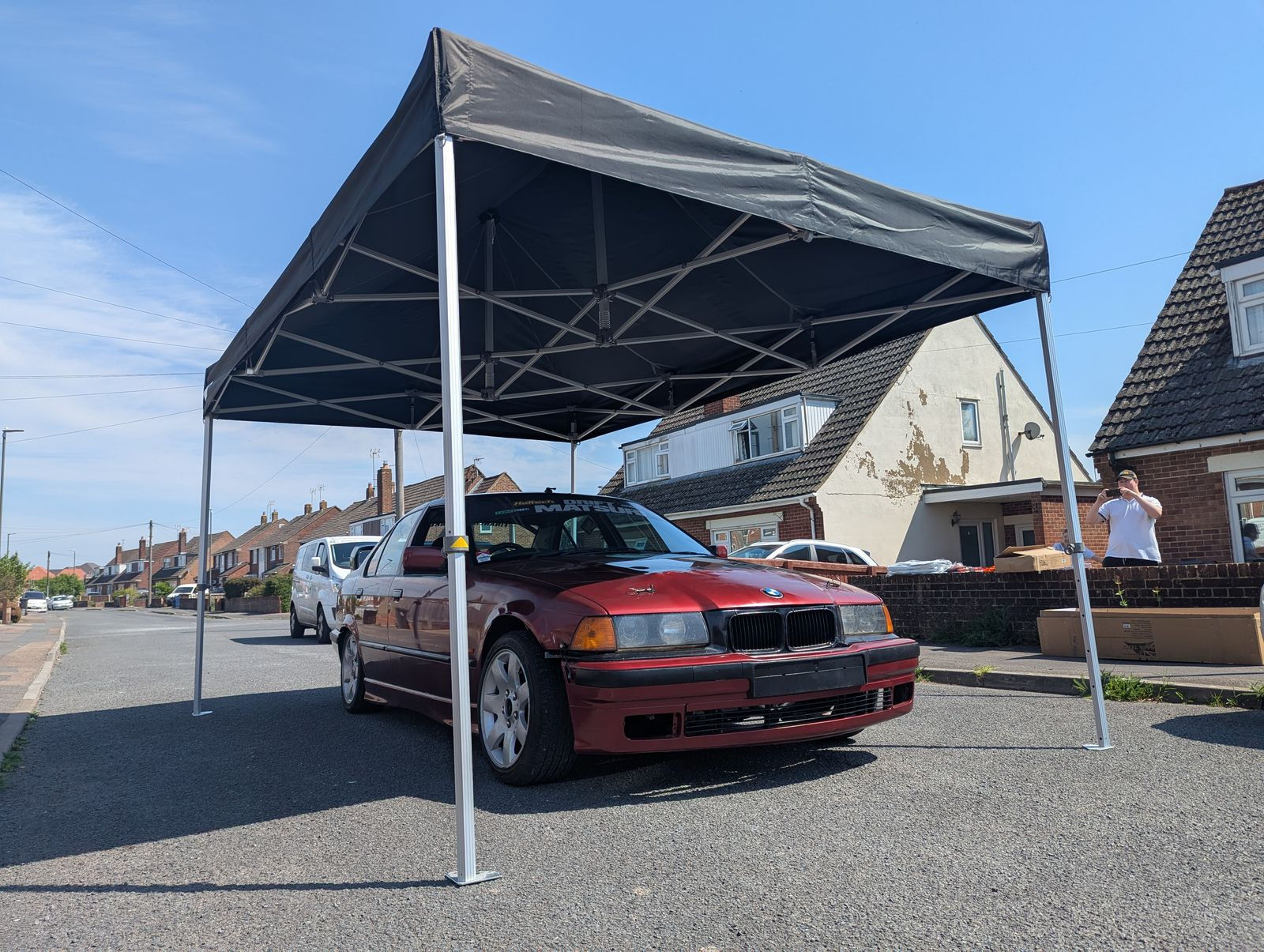 Alex's car underneath his new gazebo