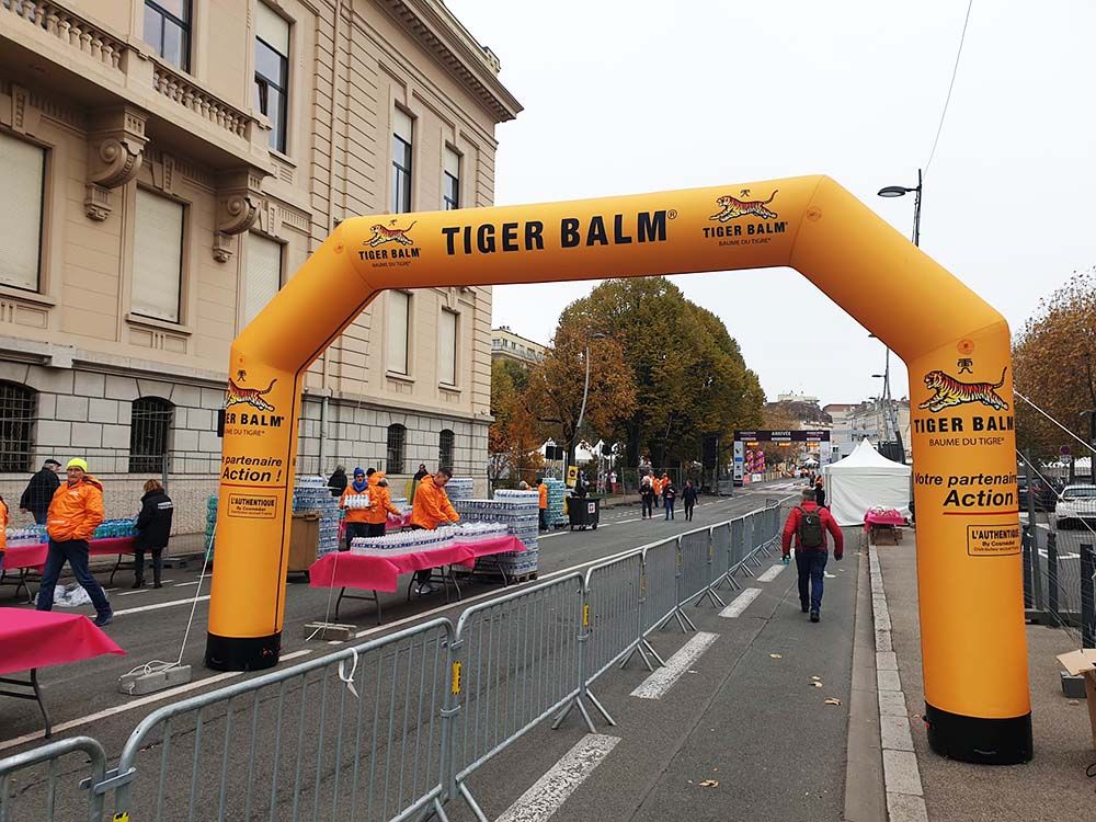 large orange inflatable arch with Tiger Balm branding