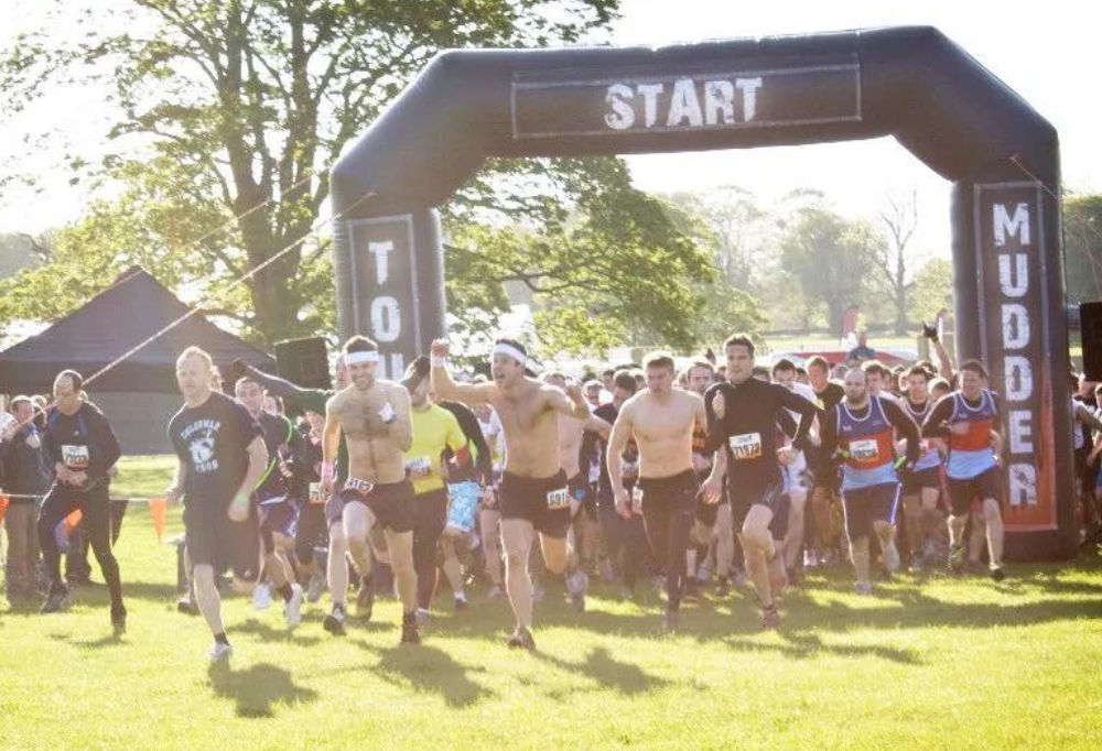 Tough mudder starting line with inflatable arch