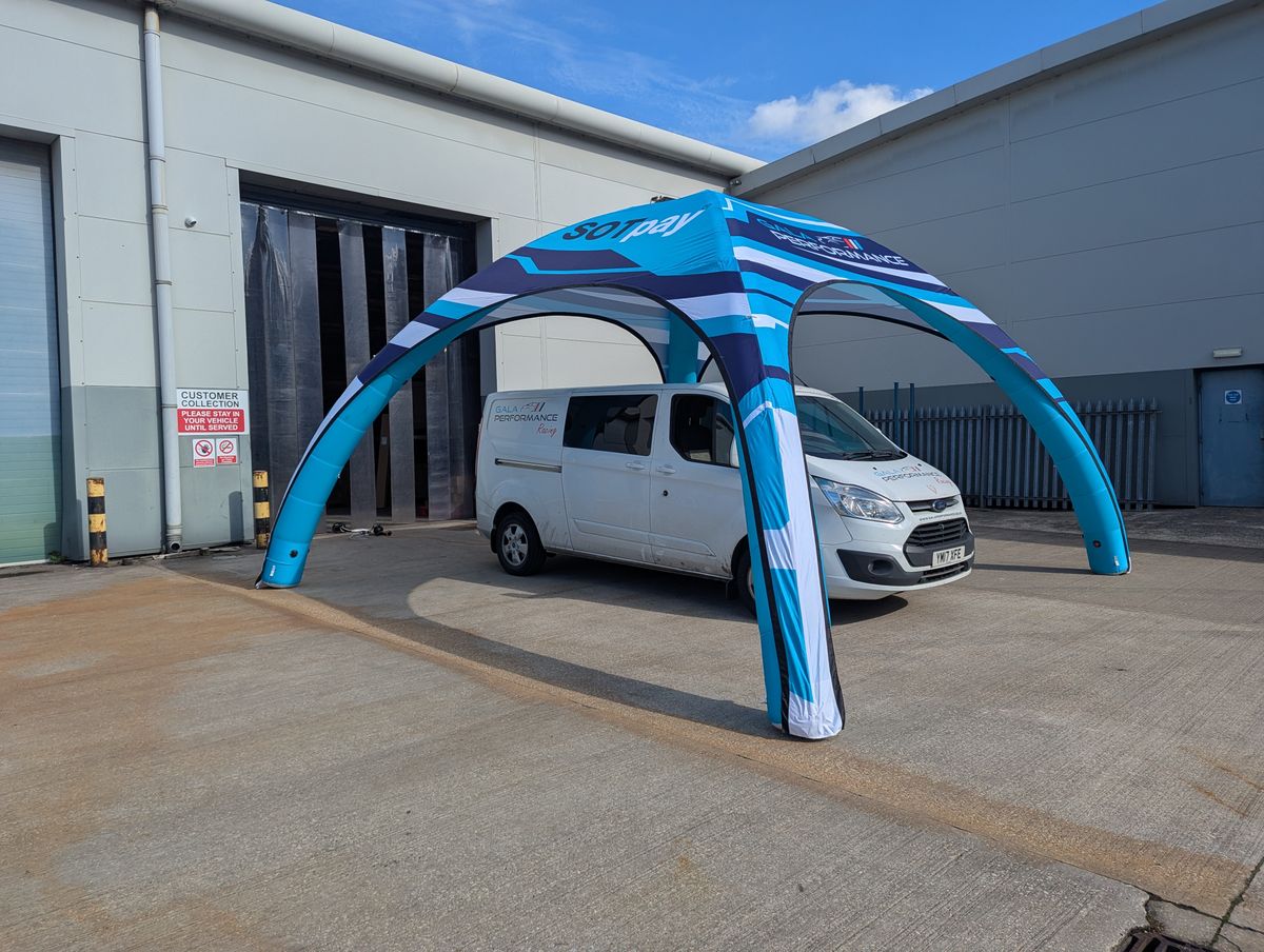 Inflatable motorsport tent