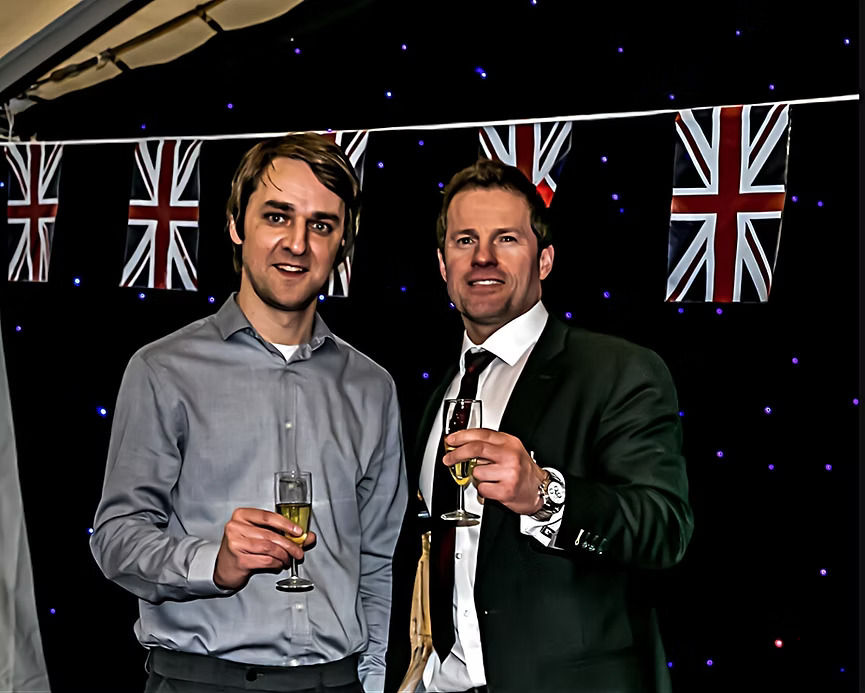 Jason Mace and Darren Perry celebrate with wine