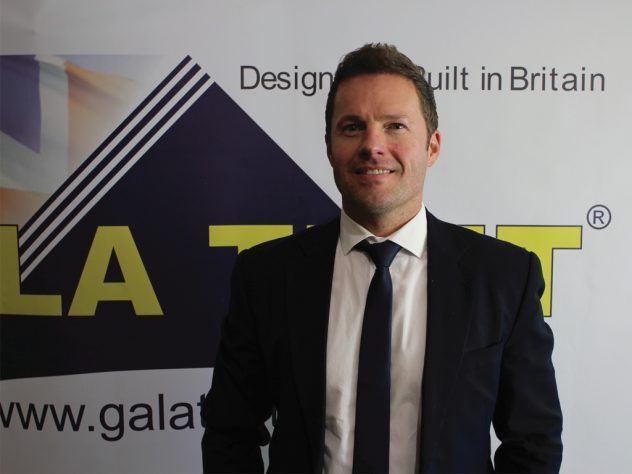 Jason Mace in front of Gala Tent logo