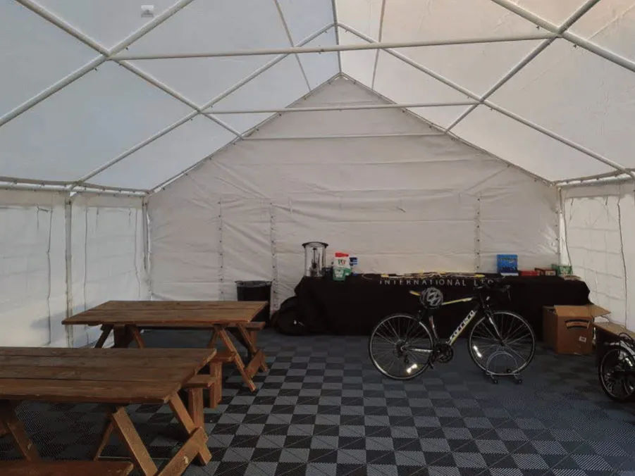 Large marquee with picnic benches inside