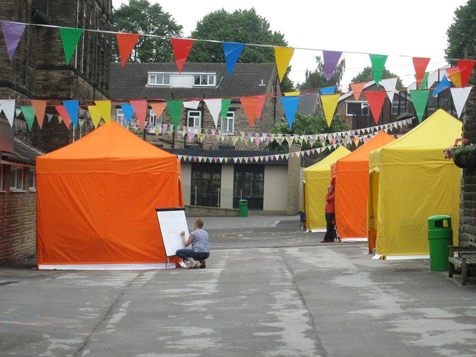 yellow and orange gazebos on market day