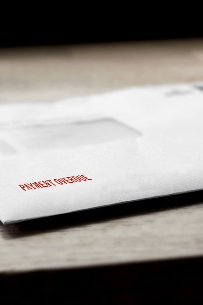 letter with "Payment overdue" on the envelope