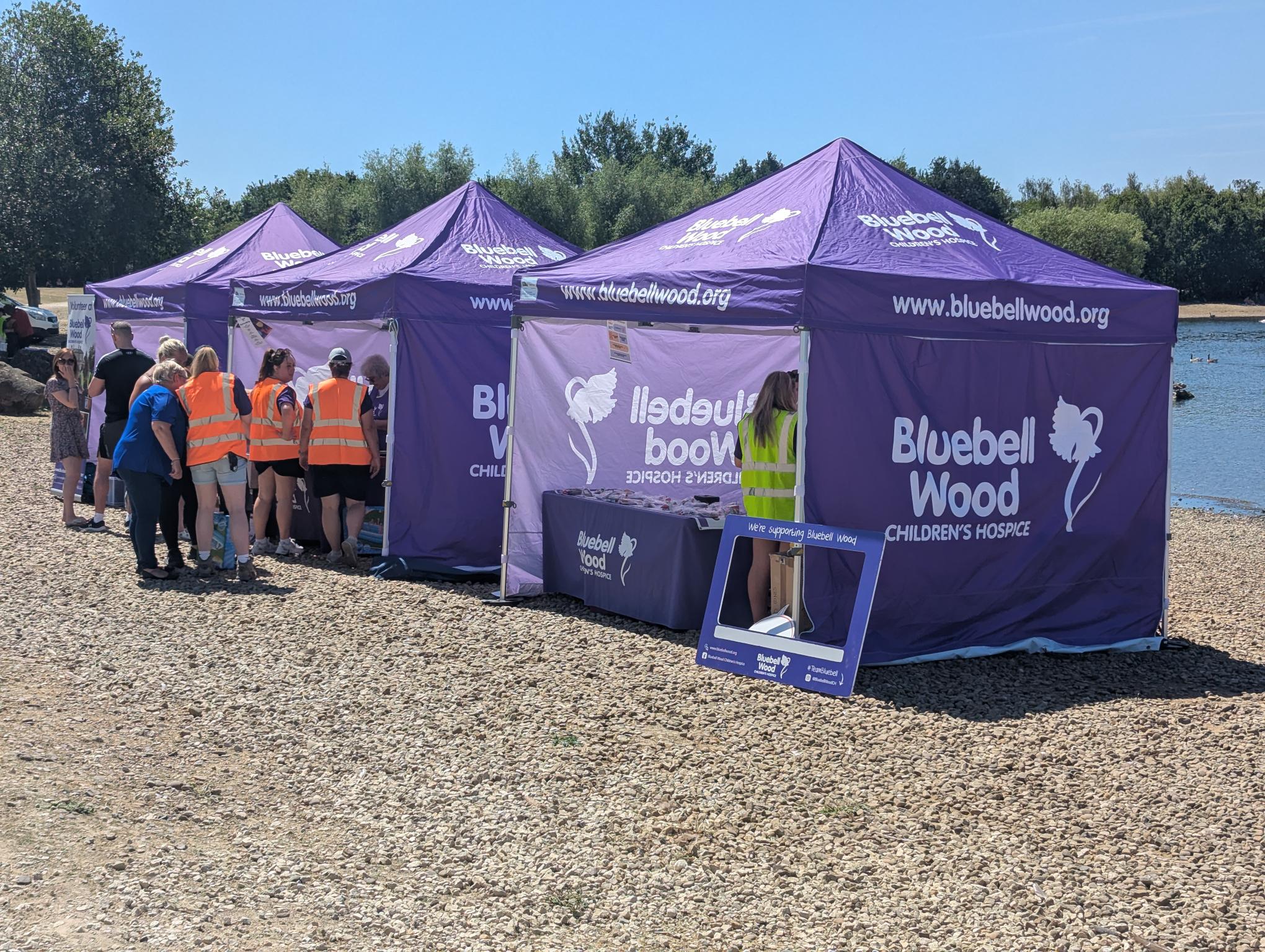 printed bluebell wood purple gazebos by a lake