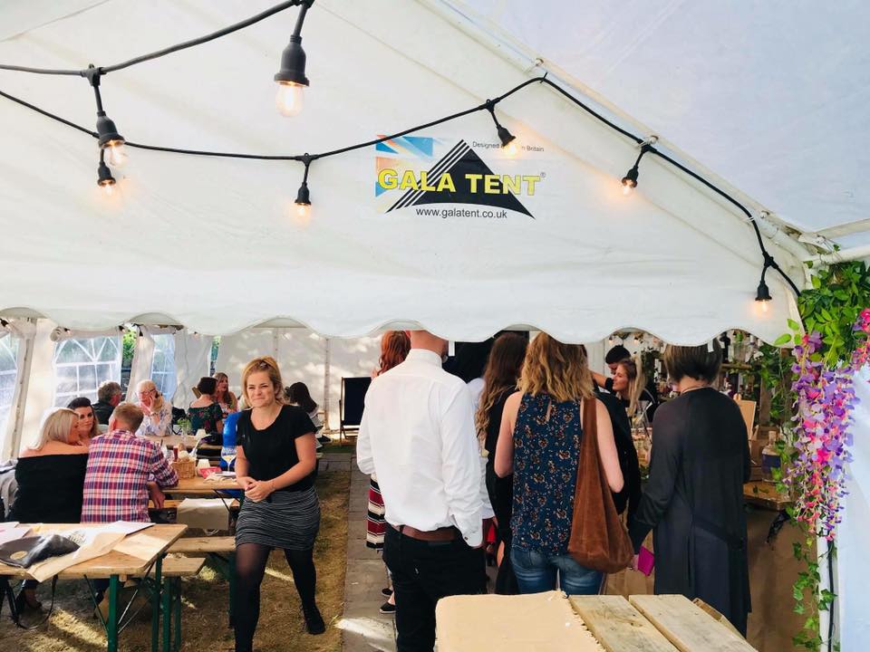 beer garden marquee with people in