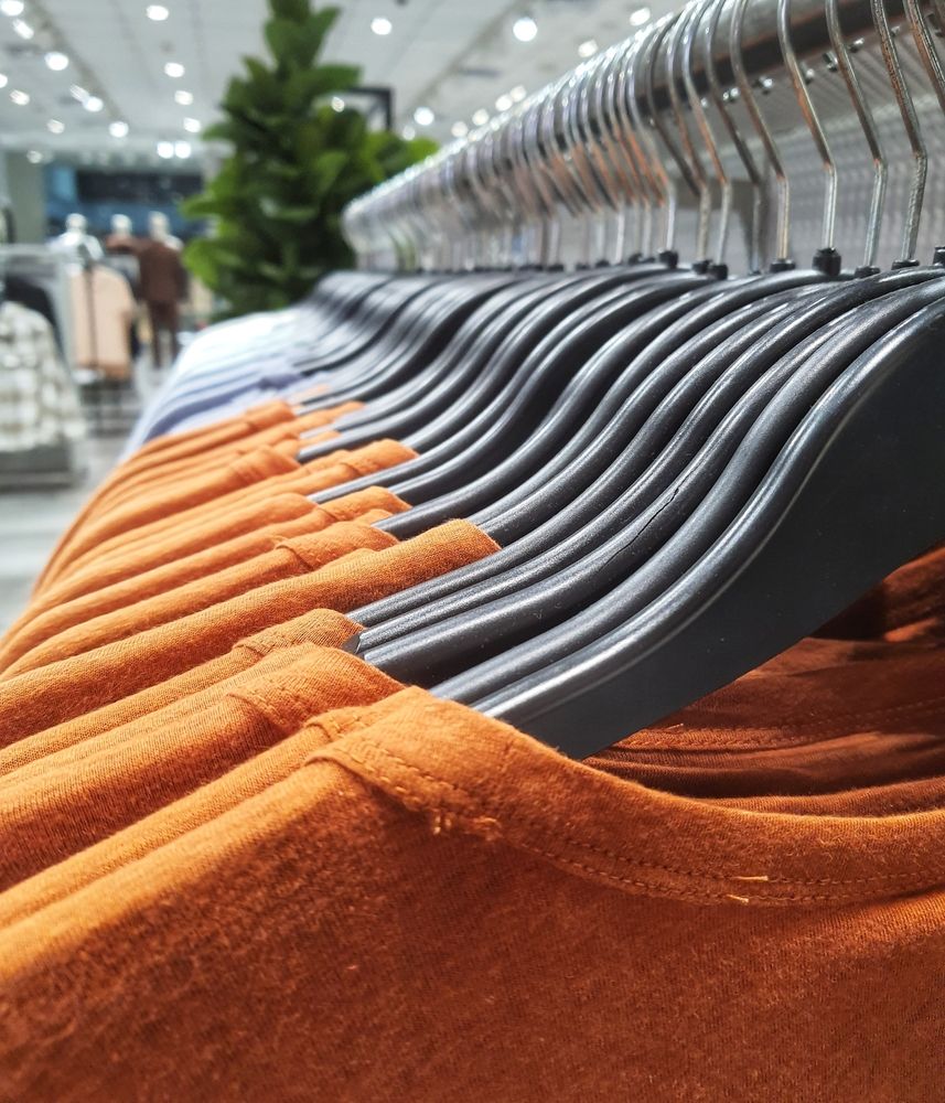 clothes on a rack in a store