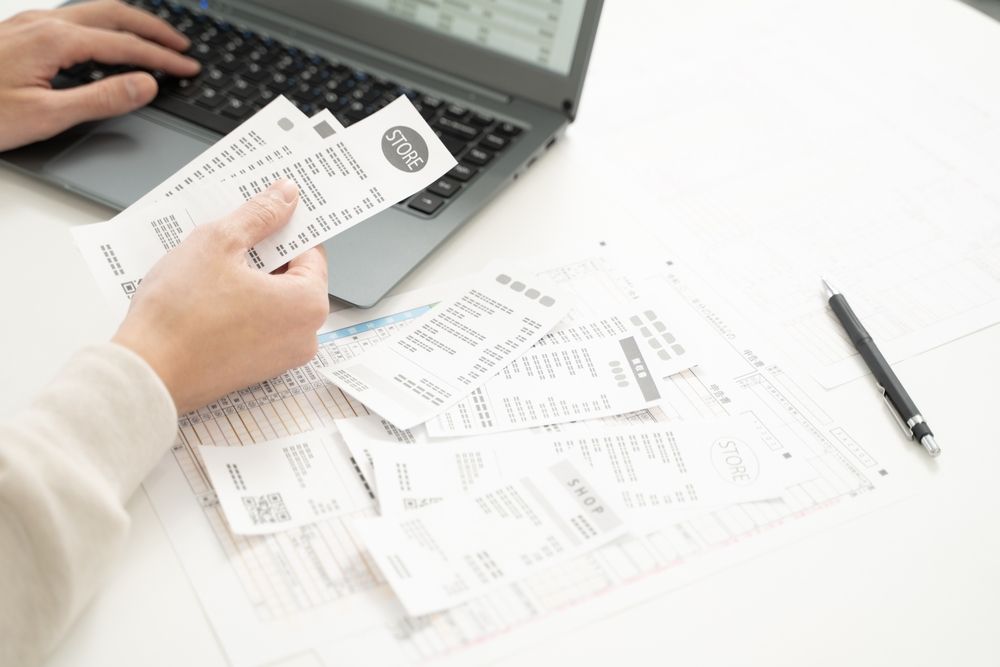 Man organizing receipts