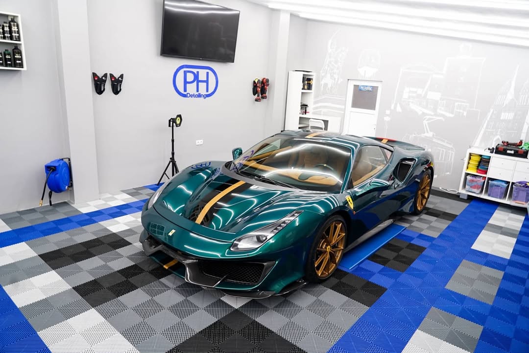 Ferrari in detailing bay with swisstrax modular flooring