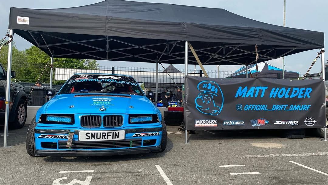 Customised car under gazebo with printed sidewalls 