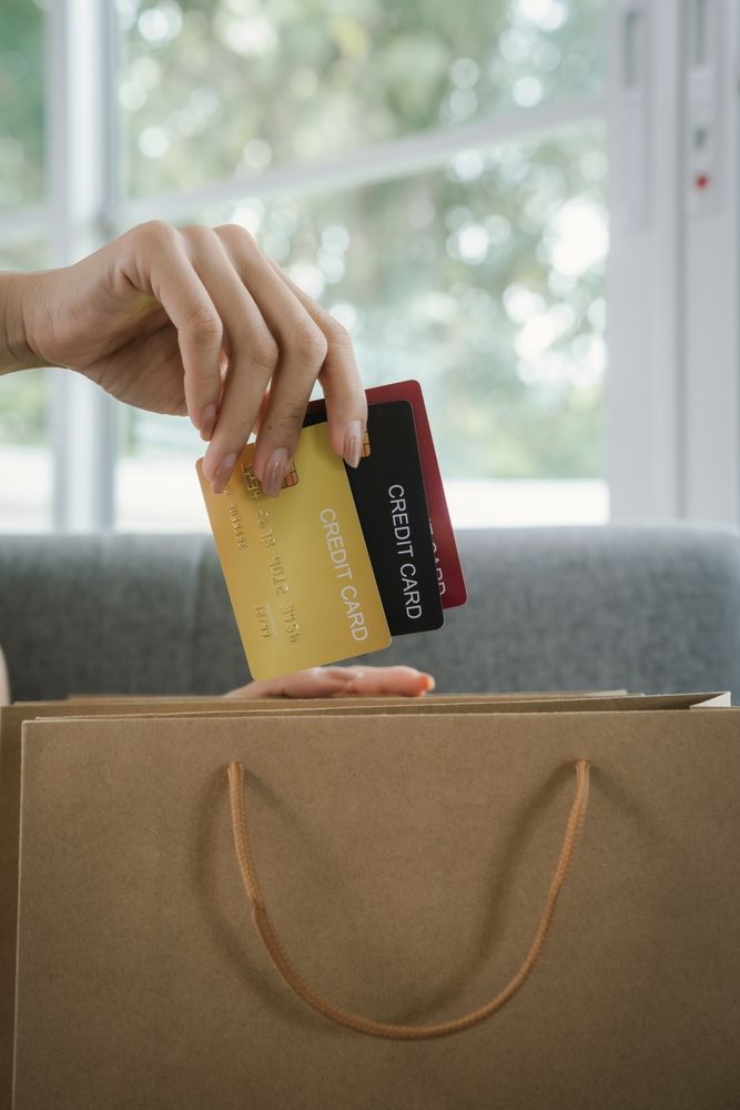 cards being taken out of a purse