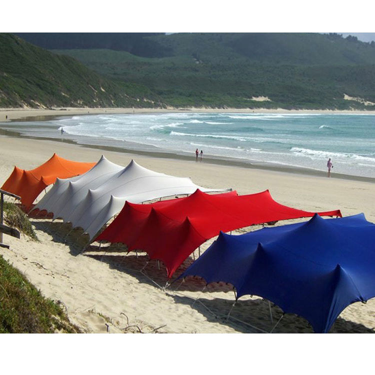 multiple colours of stretch tent on a beach