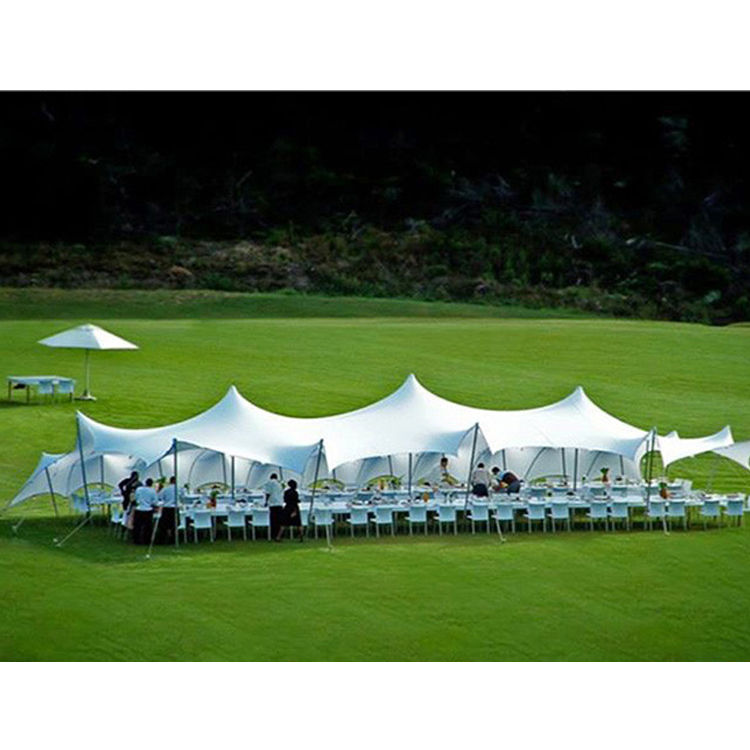 white stretch tent set up for wedding breakfast