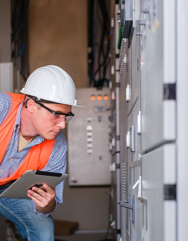engineer inspects electricals