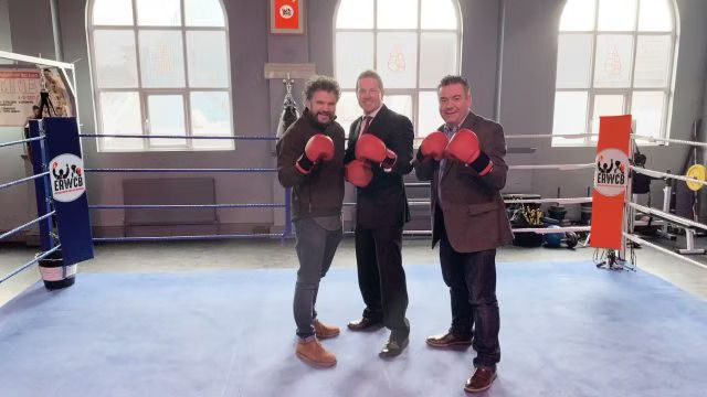 Jason Mace, John Jo Irwin and a local councillor in a boxing ring, wearing gloves