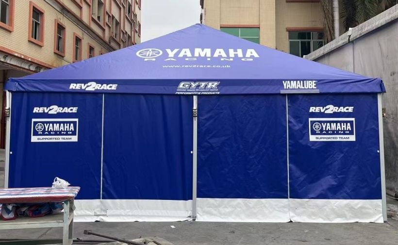 a blue Yamaha branded motorsport tent