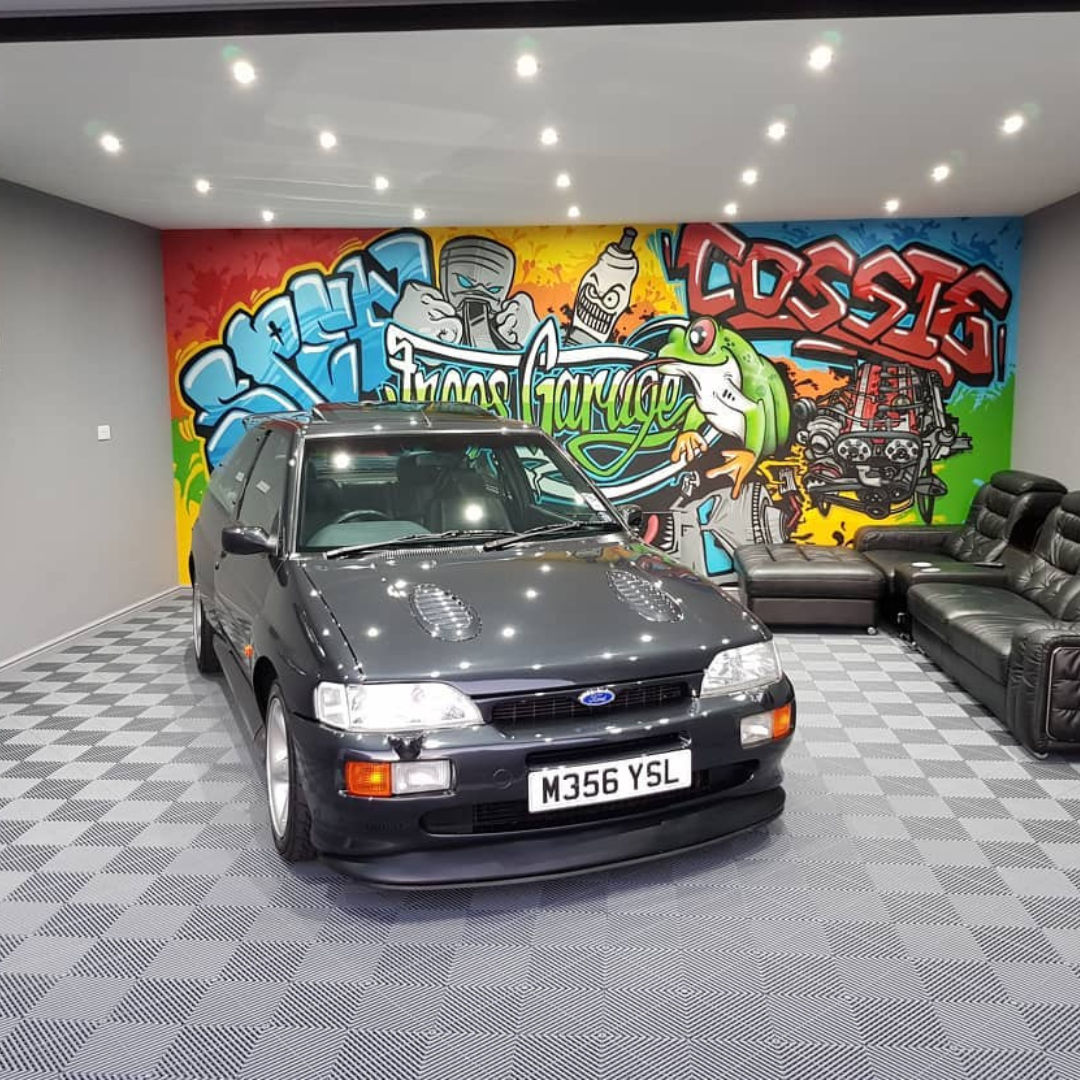 Home garage with show car on vented modular tiles
