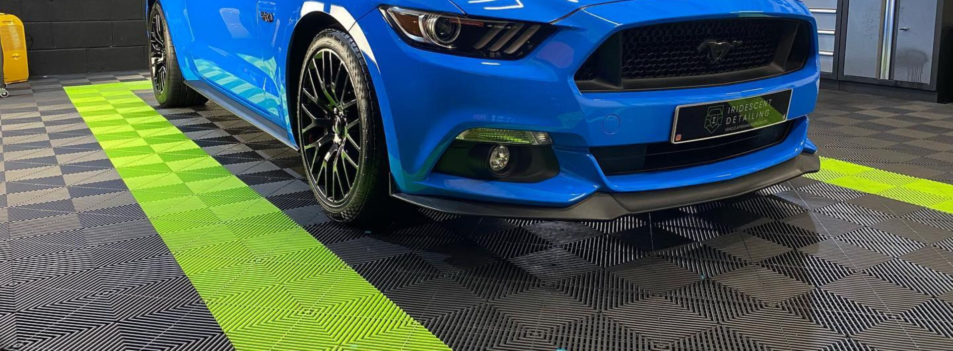 Motorsport garage with modular floor tiles