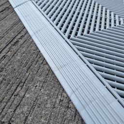 Close-up of ribbed, vented tile edge and ramp
