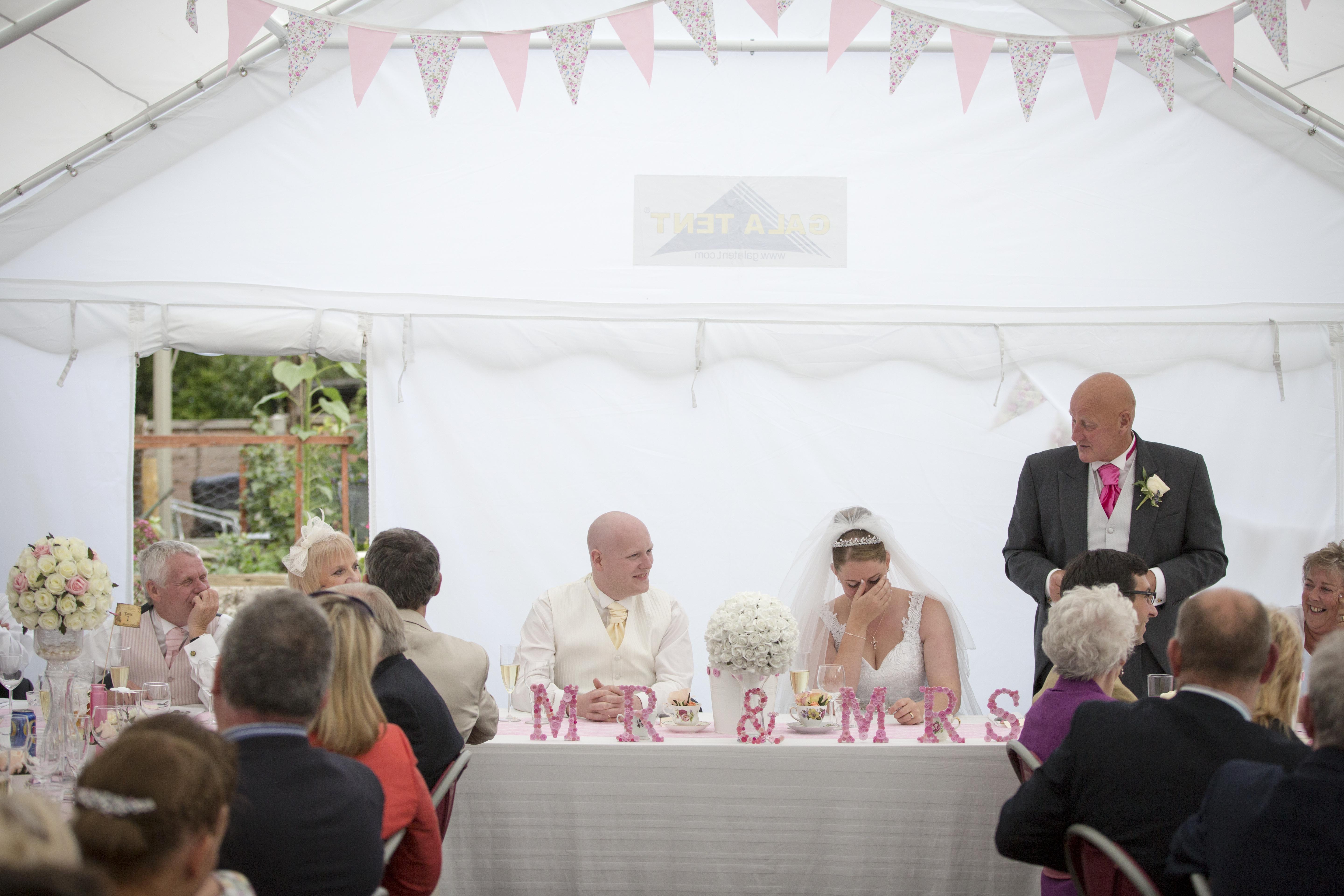 Mr & Mrs Thomas and their wedding party in the Gala Tent Marquee