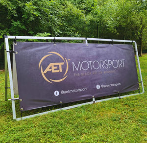 Outdoor frame banner and frame in use at event